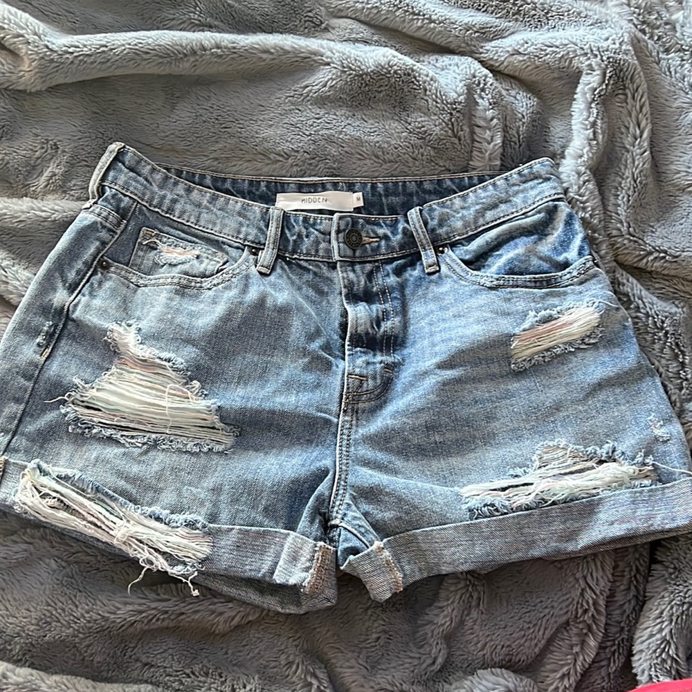 blue jean shorts with pastel rainbow rips. M